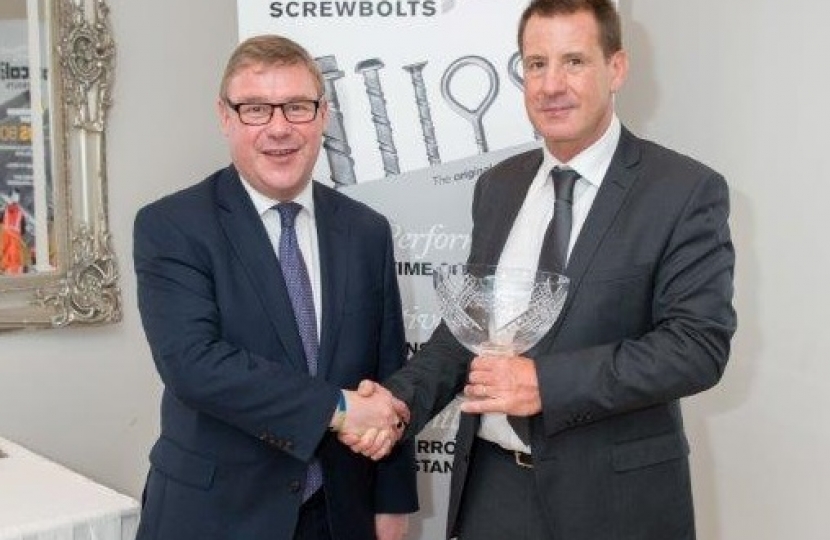 Mark Francois pictured with Director of Excalibur Screwbolts John Stevens and their recent Queen’s Award for Innovation, which was presented to the firm who are based in Hockley.