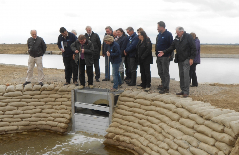 Mark Francois MP opening the sluice to allow water from the River Crouch into a major new part of the RSPB nature reserve at Wallasea Island.