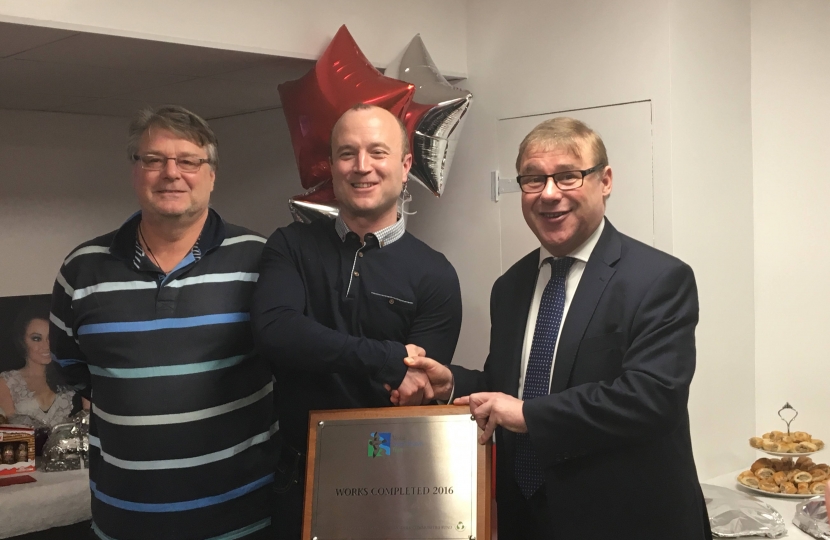 Mark Francois pictured alongside Gary Bacon of the Veolia North Thames Trust and Paul Reynolds, the chairman of the Ultima Trampoline club, handing over a plaque to commemorate the completion of their new club facilities in Wickford 