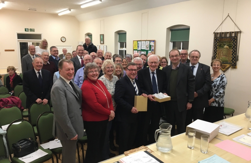 Rayleigh and Wickford MP Mark Francois presenting outgoing Chairman Hilton Brown with a special gift at the recent Rayleigh and Wickford Conservative Association Annual General Meeting.