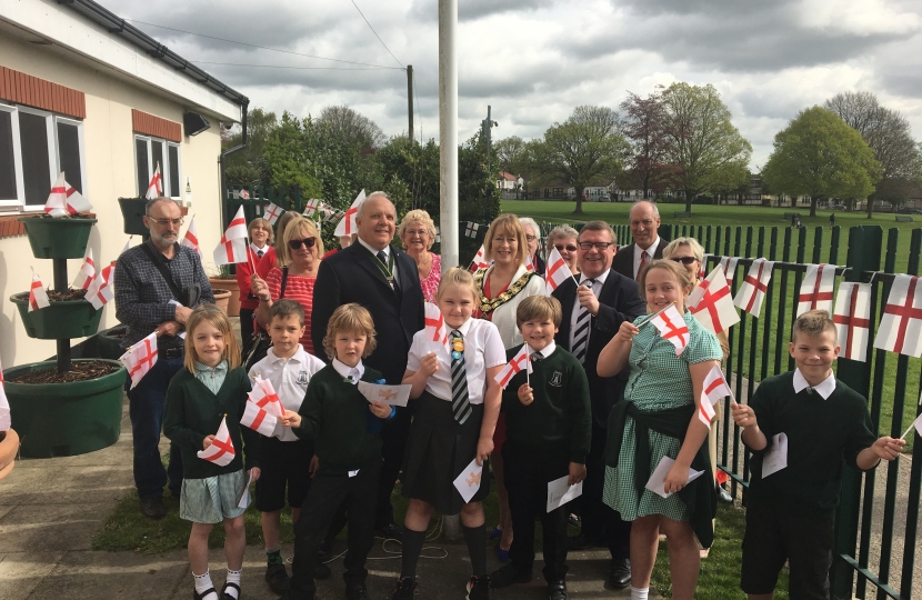 Rayleigh and Wickford MP Mark Francois pictured with Rayleigh Town Council Chairman Councillor Carol Pavelin and pupils from Glebe Primary and Fitzwimarc Schools at the raising of the St George’s Flag Ceremony.