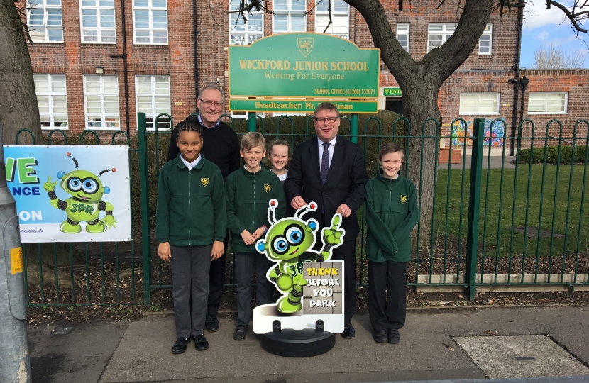 Mark Francois pictured with Headteacher Mr Terry Flitman and pupils backing the new parking scheme in operation at Wickford Junior School.
