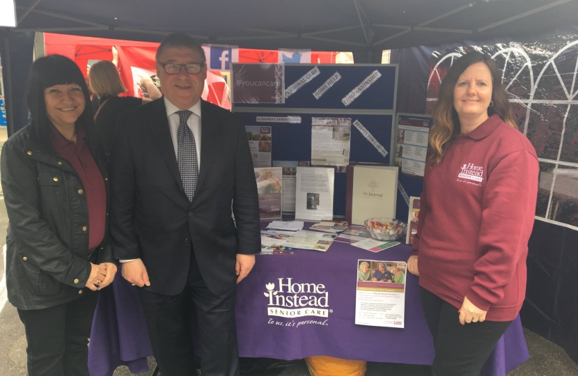 Mark Francois MP pictured with Helen and Jo from local care company Home Instead during his recent visit to the May Fest event in Basildon.