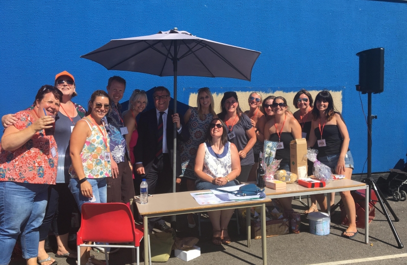 Rayleigh and Wickford MP Mark Francois pictured with Mrs Wass the headteacher of Holt Farm Junior School and members of the Parent Teacher Association at their very successful school summer fete.