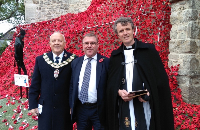 Rayleigh and Wickford MP Mark Francois alongside Councillor Jack Lawmon and Reverend David Oxtoby at a special ceremony to mark the installation of the World War One poppy waterfall at Holy Trinity Church, Rayleigh.