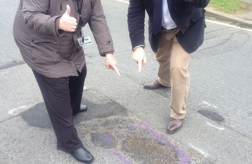 Mark Francois MP and Councillor Cheryl Roe pointing out potholes
