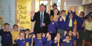 Mark Francois with Headteacher Miss Danniells, staff and pupils outside the special chill out room, which he saw during a recent visit to Abacus Primary School in his constituency