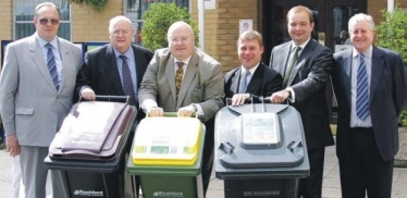 Mark helping show Secretary of State for Communities and Local Government, Eric Pickles MP, the Rochford District Council "three bin" recycling system